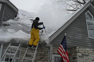 Troy Michigan Roofers Removes Ice Dam From Roof Of Home