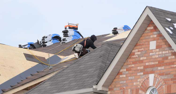 Roof Replacement in Michigan with Roofers on House
